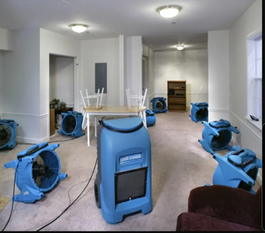 Air movers and dehumidifier setup for Water Extraction & Removal in Center